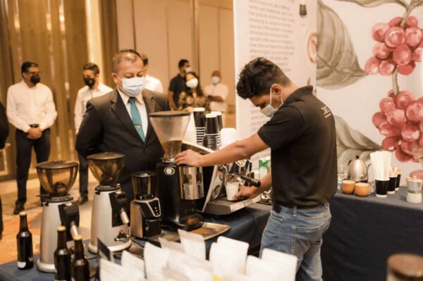 A Barista brews coffee at the first-ever Sri Lanka Coffee Festival, featured in BeanScene Magazine