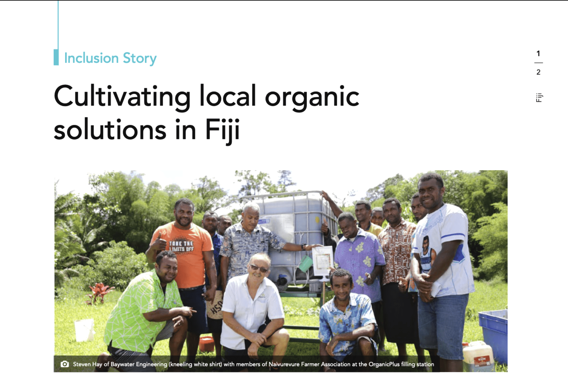 Group of farmers and partners gathered around an OrganicPlus filling station in Fiji.