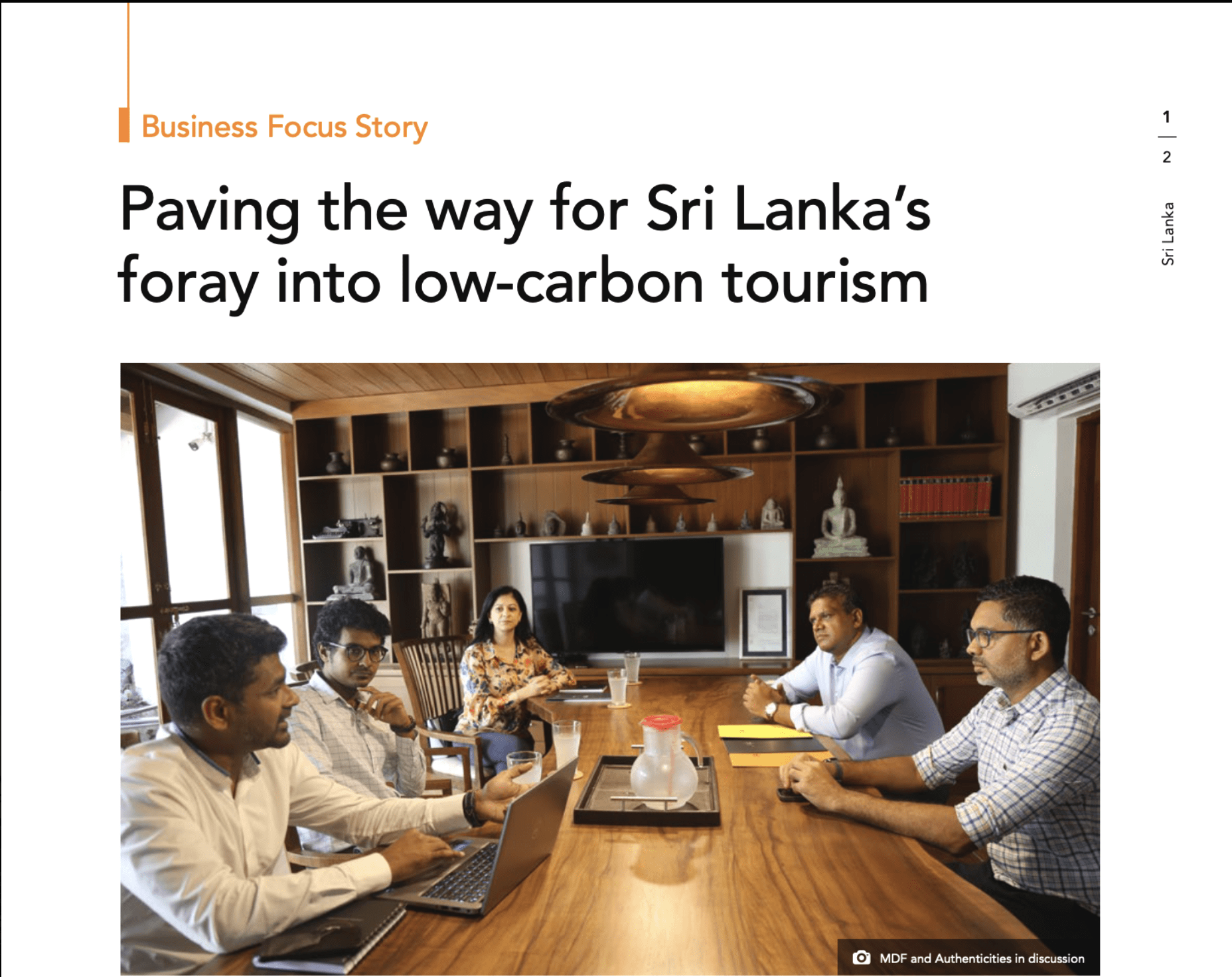 Group seated around a meeting table discussing low-carbon tourism in Sri Lanka.