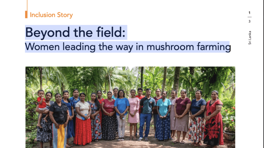Group of women mushroom farmers and staff standing together outdoors in Sri Lanka.