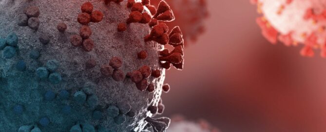 Illustration of COVID-19 virus particles in red and blue tones.