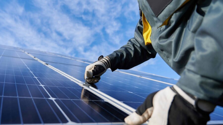 Rooftop solar panels installed on a building, representing clean energy access in the Pacific.