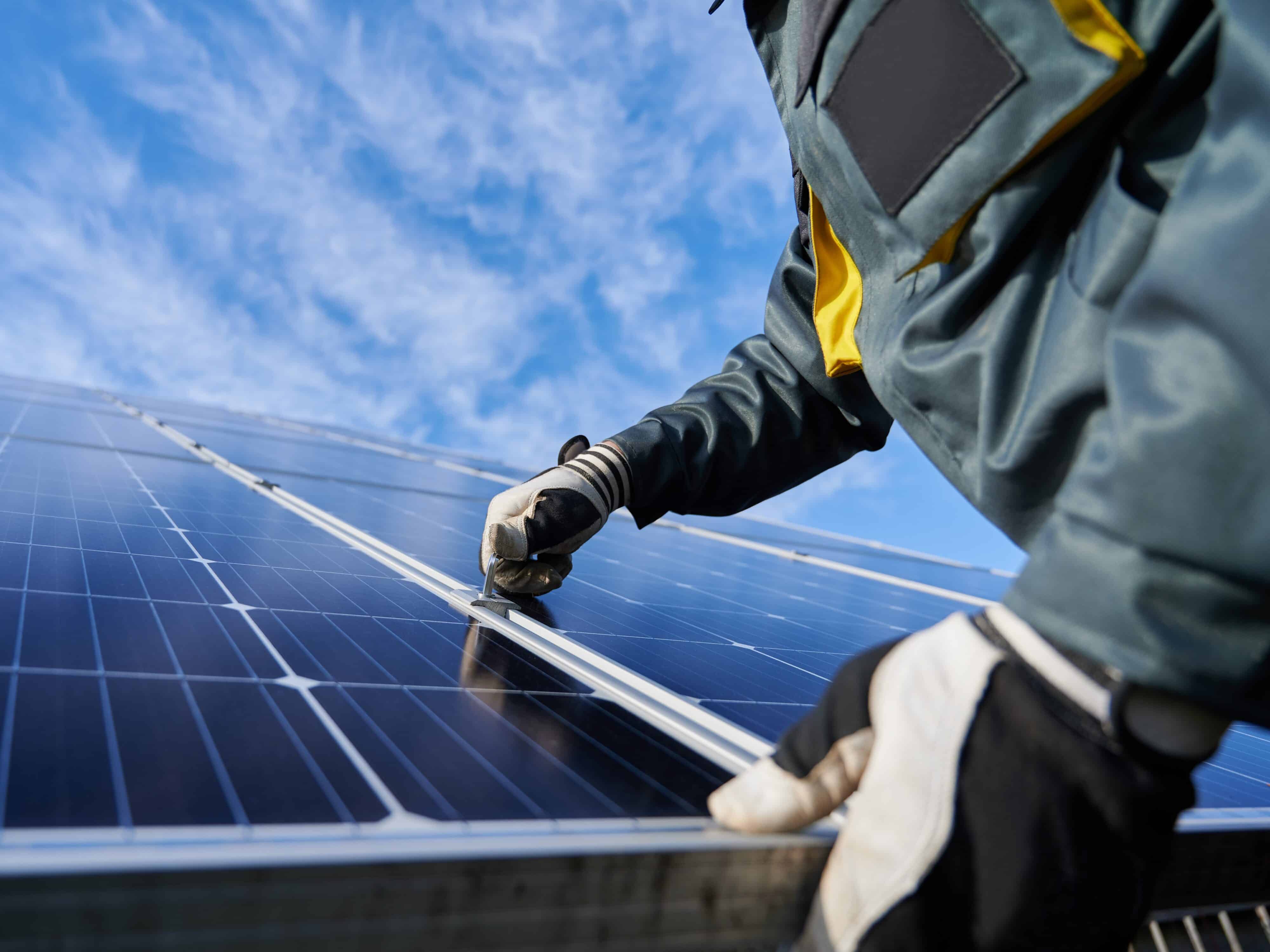 Rooftop solar panels installed on a building, representing clean energy access in the Pacific.