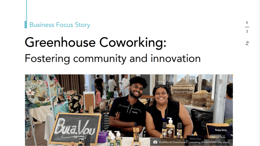 Two people smiling at a BulaVou market stall during a Greenhouse Coworking event in Fiji.