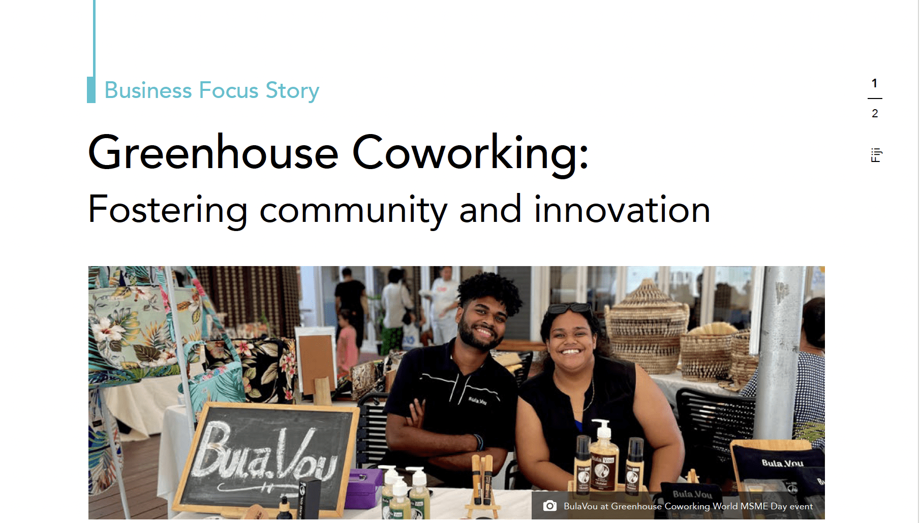 Two people smiling at a BulaVou market stall during a Greenhouse Coworking event in Fiji.