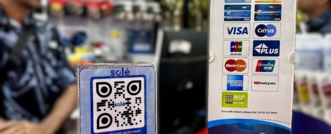 Solé QR payment code and card acceptance sign displayed on a retail counter.