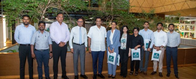 Group of representatives standing together at a Dilmah venue in Sri Lanka.