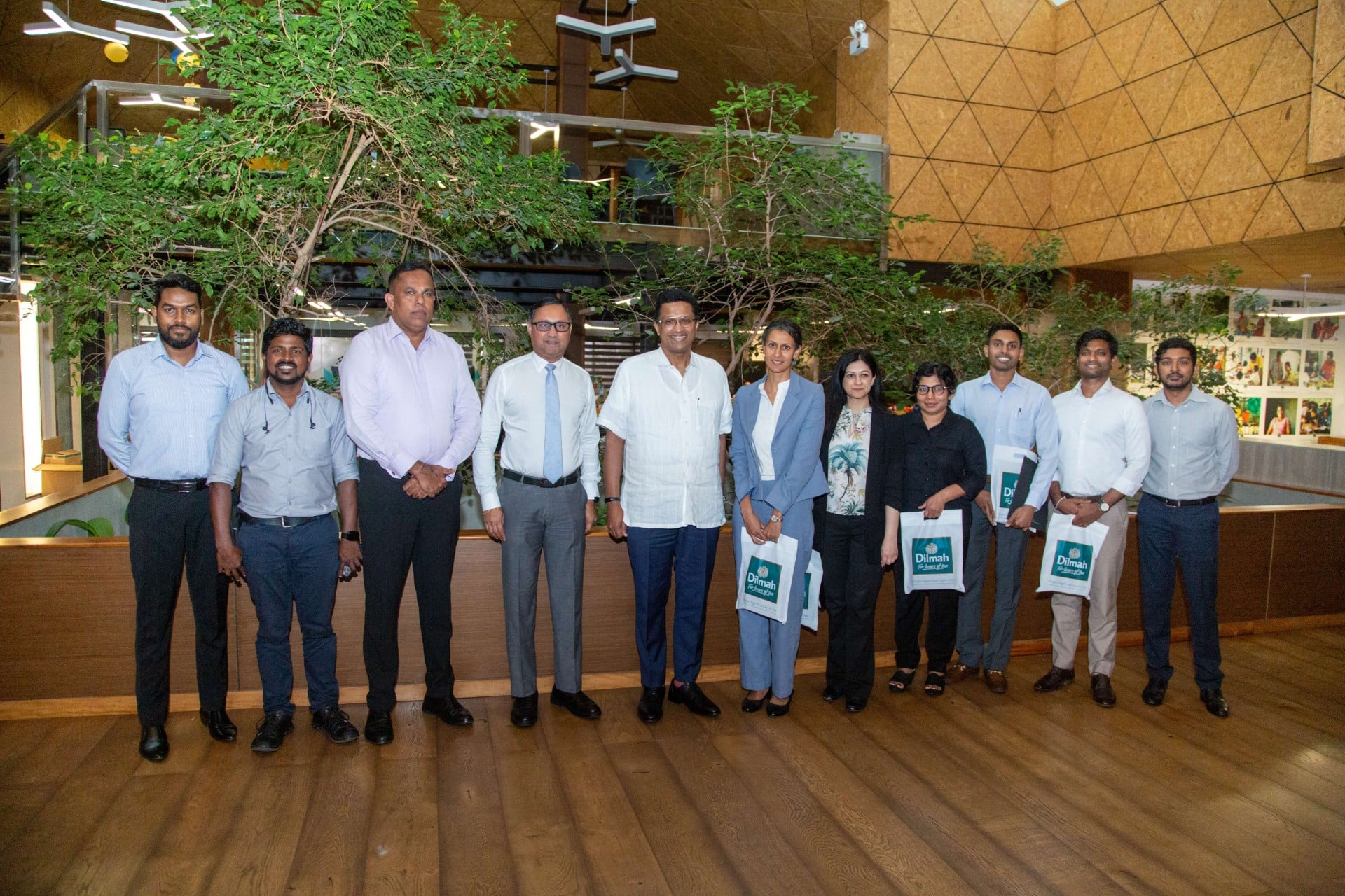 Group of representatives standing together at a Dilmah venue in Sri Lanka.