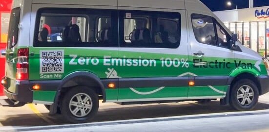 Zero-emission electric van parked at a charging station in Fiji.