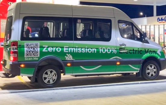 Zero-emission electric van parked at a charging station in Fiji.